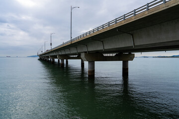 a long highway bridge on the sea