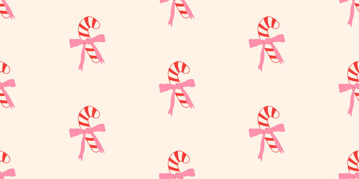 Christmas seamless pattern with cute candy canes and pink bows in a flat, hand-drawn style. Festive background for winter holidays for wrapping paper or textile, vector illustration.