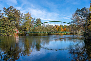 Bridge across Motala Stream connecting city park Åbackarn wirh Folkparken on a sunny autumn day in mid-October 2025 in Norrköping, Sweden