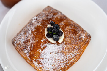 blueberry pie on a white ceramic dish