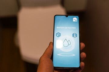 Smart Home: Man Controlling Heating Using App