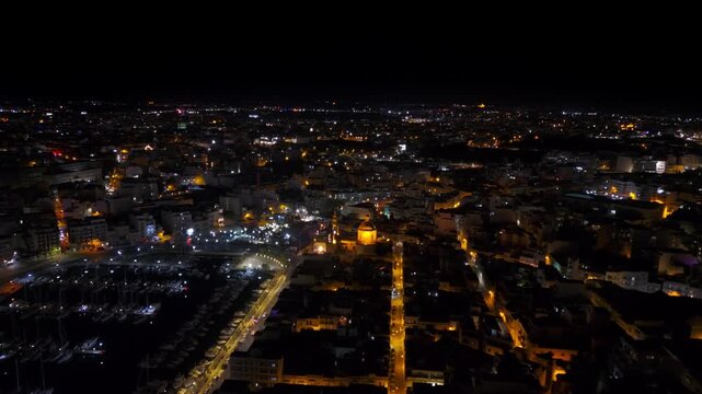 Night drone view, flight towards St. Joseph&rsquo;s Church, Msida. Valletta, Malta.