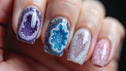 A creative manicure with detailed geode and crystal-themed nail art