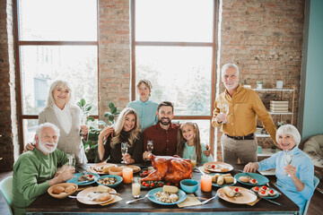 Warm family gathering around a festive Thanksgiving table with multiple generations sharing turkey dinner and joyful celebration