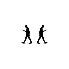Two Silhouettes of Men Walking and Using Smartphones.