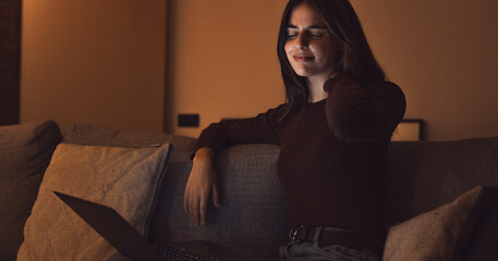 Stressed woman at late night having strong terrible neckache attack after computer laptop study,...