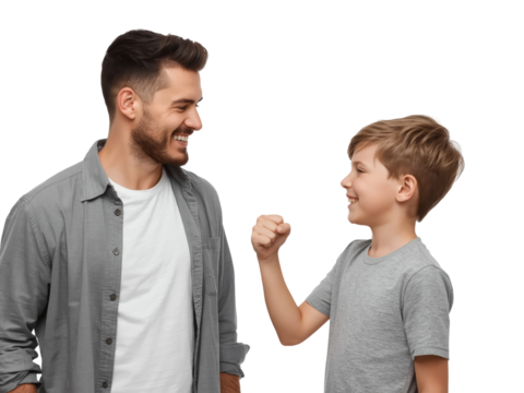 Joyful father and son bonding, playfully engaging in a fist bump against a transparent backdrop