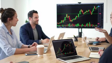 Diverse young professionals in smart casuals collaborate in modern co-working space with financial monitor, soft natural light. Concept of tech innovation - Powered by Adobe