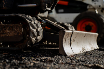 Resting dozer blade symbolizing readiness, strength, and human engineering control over surface and...