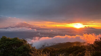 A breathtaking sunrise over a mountainous landscape, with golden sunlight piercing through the clouds and illuminating the peaks.