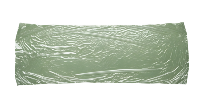 Translucent plastic sheet with wrinkles and folds overlaying a smooth, solid light green backdrop.