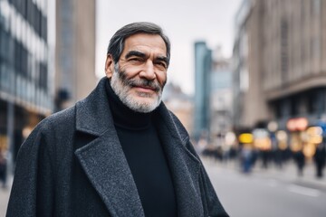 Naklejka premium Handsome Middle-Aged Man Smiles in an Urban City During the Day