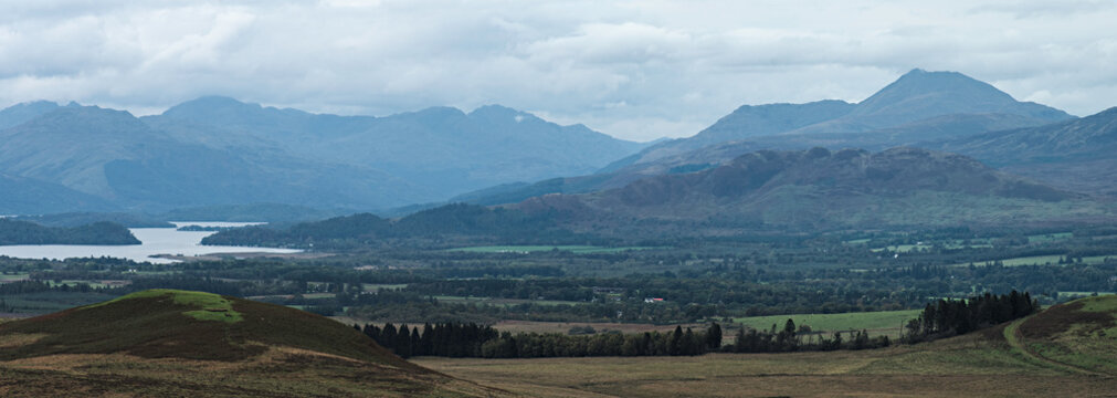 Cloudy day view of Ben Lomond, the Arrochar hills and Conic Hill from the hillside above Queen's View on the A809 road between Milngavie and Drymen north of Glasgow, Scotland. OS map ref  NS 511 808.