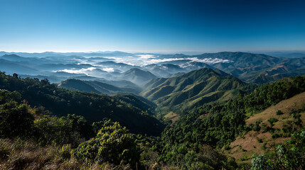 Obraz premium Cloud-covered mountain ranges in Mae Hong Son, Thailand, presenting a wild natural panorama background for various media.