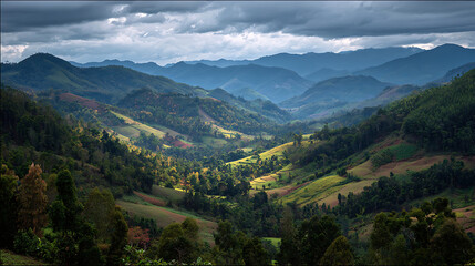 Naklejka premium Verdant layered hills with wispy clouds in Thailand Mae Hong Son, showing a beautiful natural landscape.