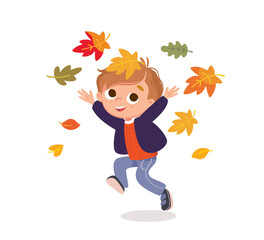 Boy plays with falling yellow and orange leaves, kid surrounded by yellow leaves. Autumn mood, arrival of fall.
