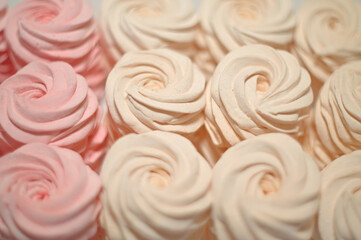 Beautiful background of hand-made marshmallows in pink and beige, color photo of food, sweets and treats
