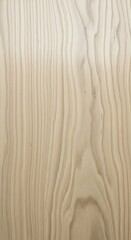 Close-up of a light brown wooden surface with natural grain patterns.
