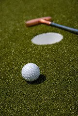 golf mallet on the green, artificial turf