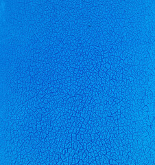 Grunge blue background with cracked paint. Old blue paint on the wall texture. Abstract background for design with copy space for text or image.
