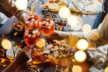 Glasses with aperol spritz seen during a friendly party of a celebration.