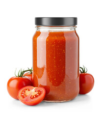 Clear glass jar filled with tomato Sauce with a glossy cap and surrounded by fresh tomatoes
