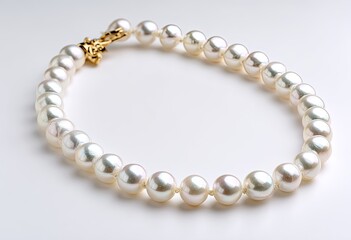 Luxurious string of luminous, spherical gems, secured by a decorative gold clasp, on white background