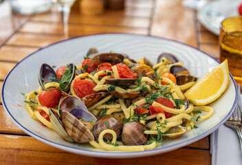 Pasta linguini vongole with clams and white wine at a restaurant in Nice, France