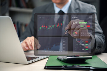 Businessman in office use FinTech dashboard. AI analysis stock trading data. Virtual screen show financial growth chart. Investment technology strategy, corporate business solution.