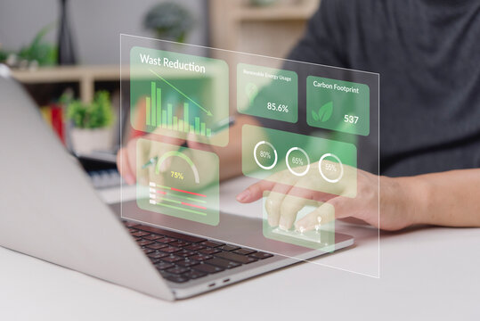 Businessman analyze sustainability data virtual interface. Technology dashboard for waste reduction, renewable energy, carbon footprint. Green business innovation, environmental strategy concept.