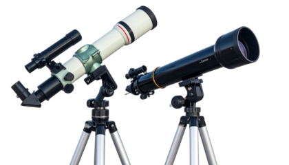 Pair of astronomical telescopes with tripods isolated on white background