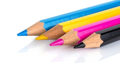 Close-up of four colorful pencils, blue, yellow, pink, and black, on a white surface