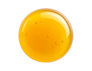 Circular, isolated macro of golden liquid with bubbles, reflecting light against black