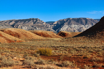 View of the Red Orange Hills below the Bighorn Mountains while Driving the John Blue Canyon Road in Wyoming.
