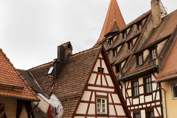Ancient european architecture: rustic timber-framed houses with tiled roofs