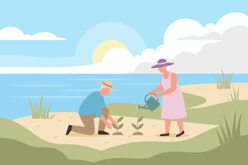 Senior couple planting and watering saplings outdoors by the water Healthy lifestyle nature growth