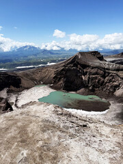 Volcanic Crater Lake under a Clear Blue Sky