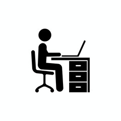 Silhouette of a person sitting at a desk with a laptop, working or studying.