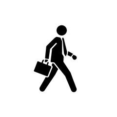 Silhouette of a person sitting at a desk with a laptop, working or studying.