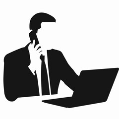 Silhouette of a person sitting at a desk with a laptop, working or studying.