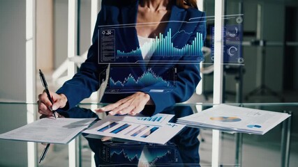 Executive analyzes financial data and charts. Businesswoman reviews finance graph on table. Analytics overlay highlights chart trend. Hand points to document showing business focus. Data insight now. - Powered by Adobe
