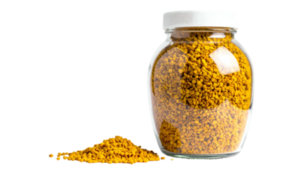 Jar of yellow granules, sealed with a white lid, and a small pile on a black backdrop