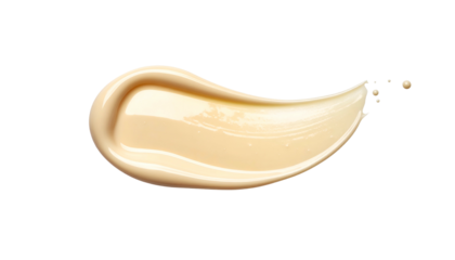 A smooth, beige cosmetic product smear with a shiny, glossy finish on a black background