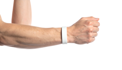 Human arm with a white wristband, fist clenched. Isolated on a black background