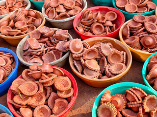 Clay lamp stall for festival celebration, Terracotta diyas or oil lamps for Diwali for sale at a market in India.