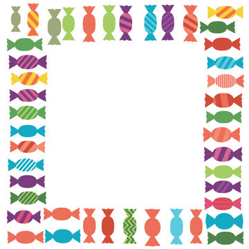 A colorful frame made of wrapped candies in a playful pattern on a white background.