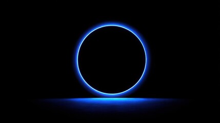 Glowing blue neon circle on a dark background with reflection