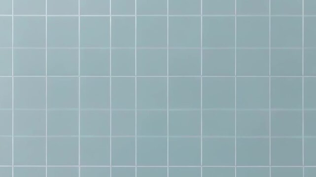 Light blue square tiles arranged in a grid pattern with white grout lines, creating a clean and uniform surface.