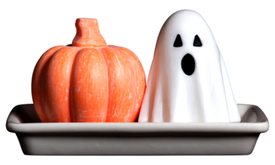 A whimsical pumpkin and ghost soap displayed together on a tray, evoking a festive bathroom Halloween theme.