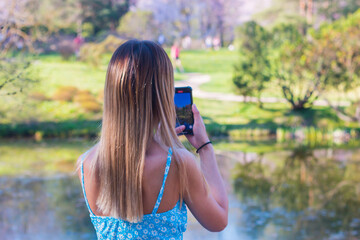 young woman taking a picture of themselves